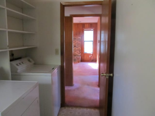 washroom featuring washer and dryer and light colored carpet