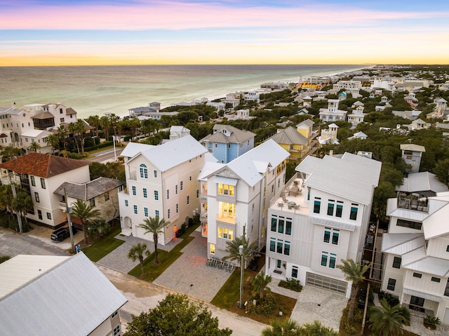 aerial view at dusk with a water view