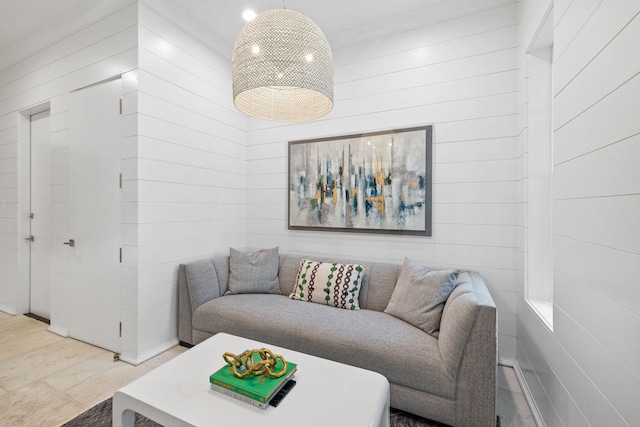 living room with wooden walls