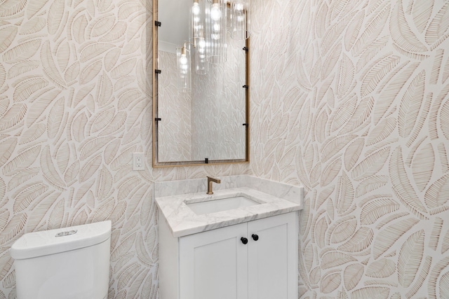 bathroom with vanity and toilet