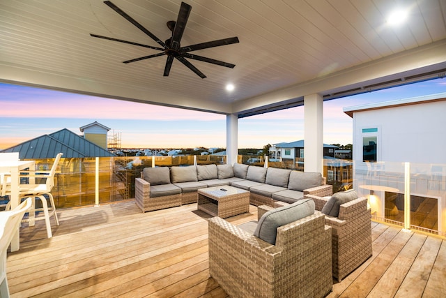 deck at dusk with an outdoor living space