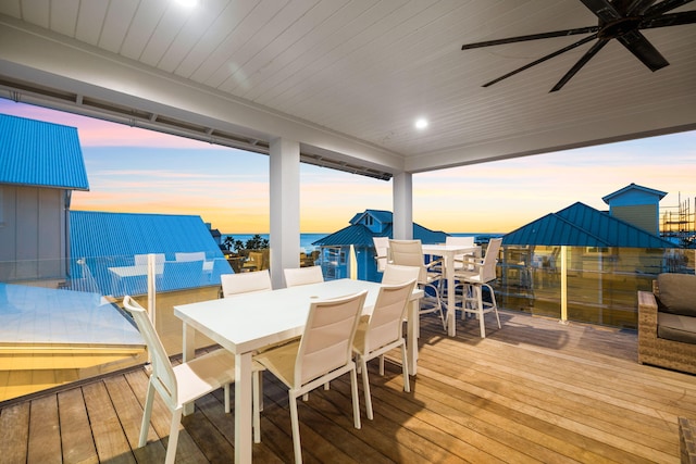 deck at dusk with ceiling fan