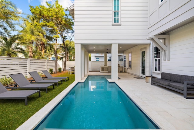 view of swimming pool with an outdoor hangout area, a patio, and ceiling fan