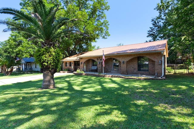 ranch-style house with a porch and a front yard