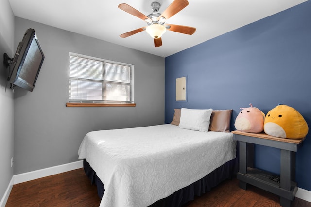 bedroom featuring ceiling fan and dark wood-type flooring