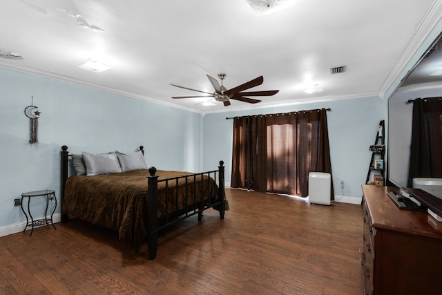 bedroom featuring ceiling fan, ornamental molding, and dark wood-type flooring