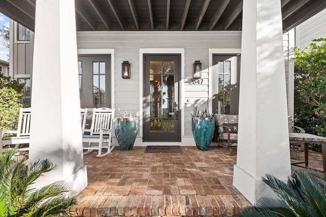 doorway to property with a porch