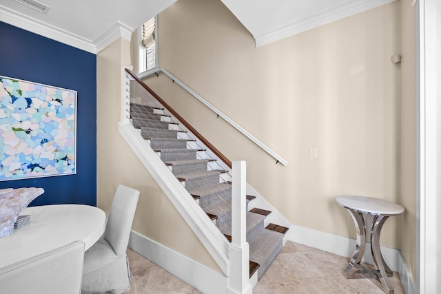 stairway with tile patterned flooring and ornamental molding