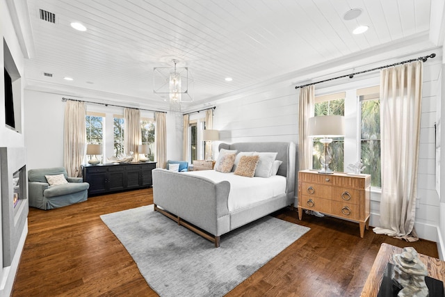 bedroom with dark hardwood / wood-style floors, wooden ceiling, and multiple windows