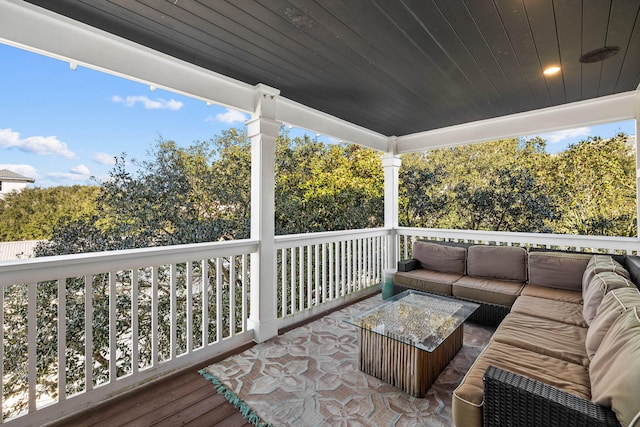 wooden terrace featuring an outdoor hangout area