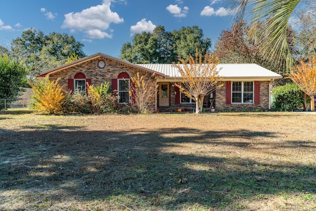 ranch-style home with a front yard