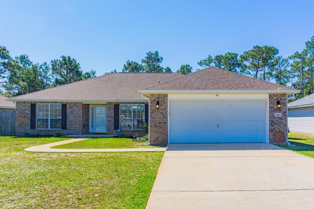 ranch-style house with brick siding, a garage, concrete driveway, and a front lawn