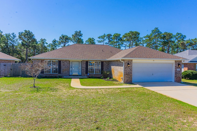 single story home with fence, concrete driveway, a front yard, a shingled roof, and a garage