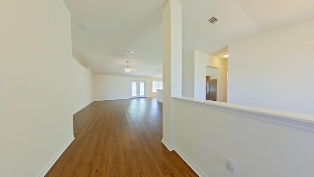8679 High School Blvd, Navarre, FL 32566 - hall featuring visible vents, baseboards, and wood finished floors