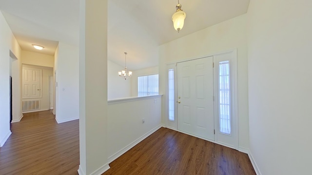 8679 High School Blvd, Navarre, FL 32566 - entryway featuring dark wood finished floors, a notable chandelier, baseboards, and visible vents
