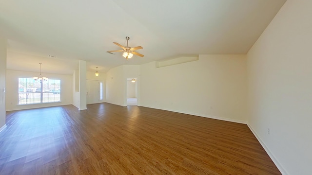 8679 High School Blvd, Navarre, FL 32566 - unfurnished living room featuring dark wood-style floors, baseboards, visible vents, lofted ceiling, and ceiling fan with notable chandelier