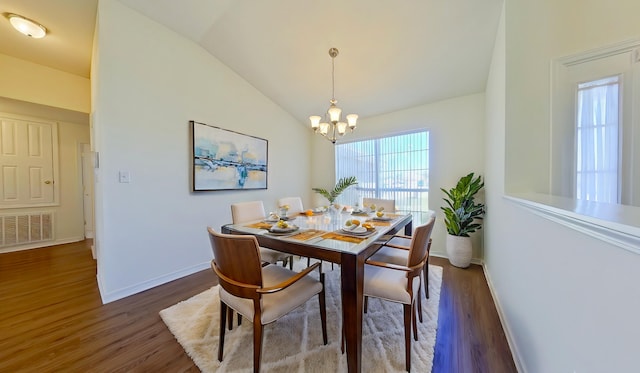 8679 High School Blvd, Navarre, FL 32566 - dining area featuring visible vents, baseboards, vaulted ceiling, an inviting chandelier, and wood finished floors
