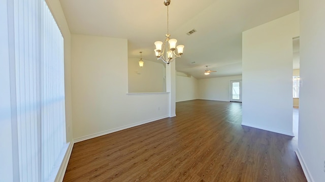 8679 High School Blvd, Navarre, FL 32566 - spare room with dark wood finished floors, visible vents, baseboards, and lofted ceiling