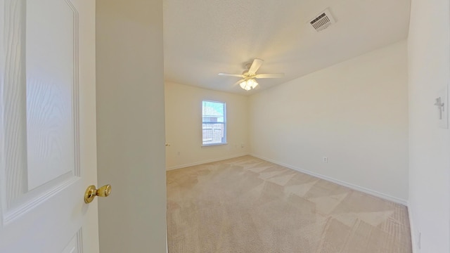 8679 High School Blvd, Navarre, FL 32566 - empty room with visible vents, baseboards, light colored carpet, and a ceiling fan