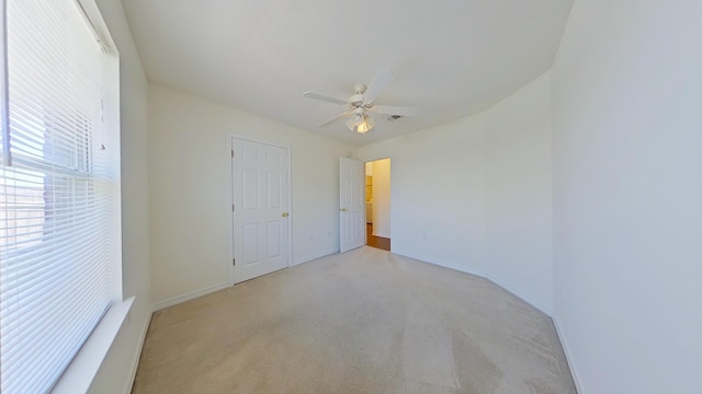 8679 High School Blvd, Navarre, FL 32566 - unfurnished bedroom featuring light colored carpet, baseboards, and ceiling fan