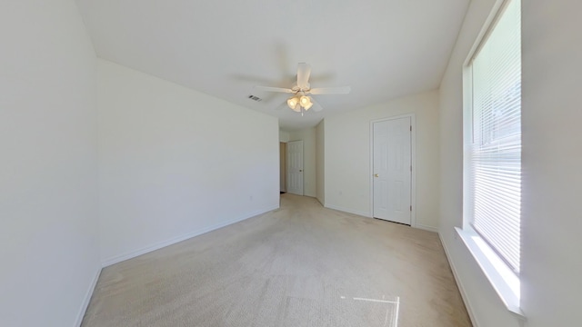 8679 High School Blvd, Navarre, FL 32566 - unfurnished room featuring visible vents, baseboards, light colored carpet, and ceiling fan