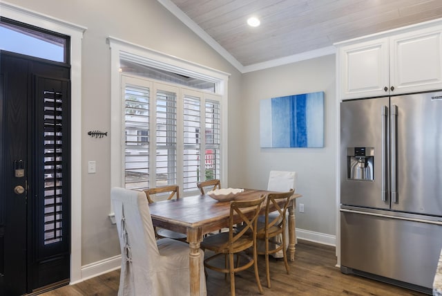 dining room featuring wooden ceiling, dark wood-type flooring, a healthy amount of sunlight, and vaulted ceiling