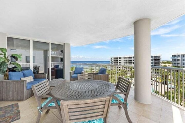 balcony featuring a water view