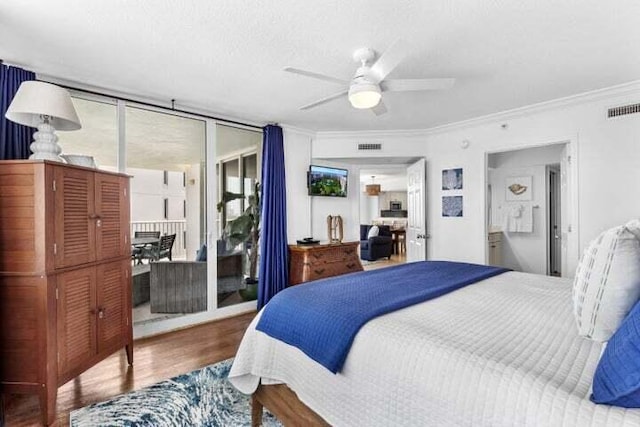 bedroom featuring ceiling fan, hardwood / wood-style floors, and crown molding