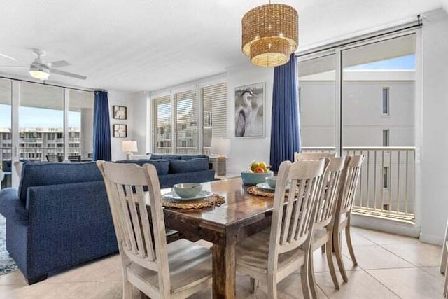 tiled dining area featuring ceiling fan and a healthy amount of sunlight