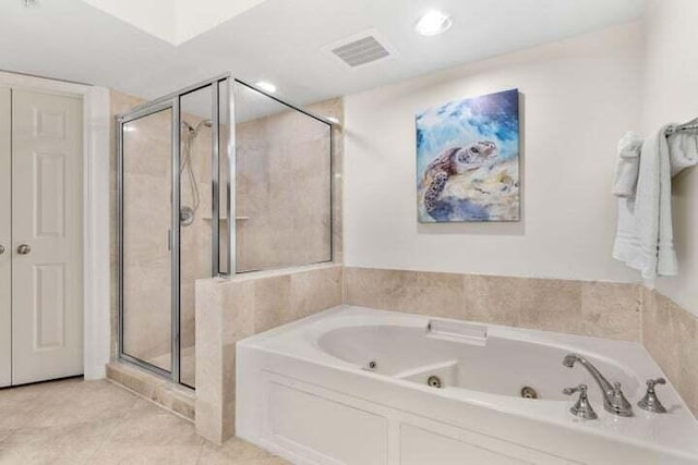 bathroom with tile patterned flooring and independent shower and bath