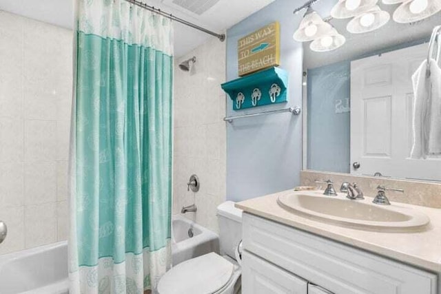 full bathroom with vanity, toilet, and shower / tub combo with curtain