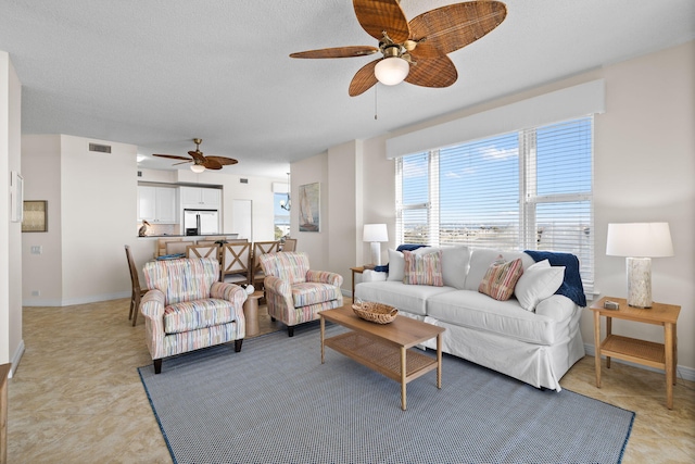 living room with ceiling fan