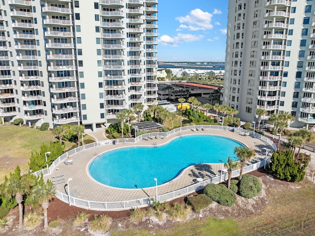 view of swimming pool featuring a water view