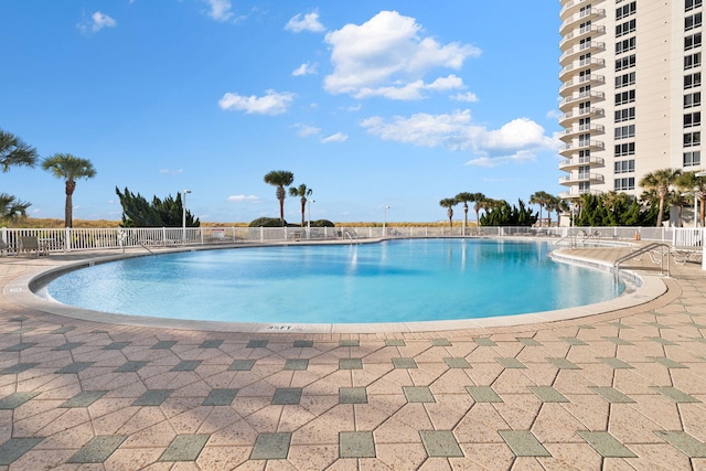 view of swimming pool featuring a patio