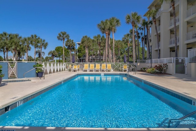 view of swimming pool with a patio