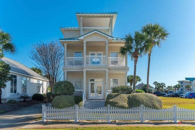 view of front of home featuring a balcony