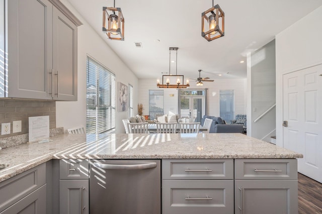 kitchen featuring gray cabinetry, ceiling fan, dishwasher, and hanging light fixtures