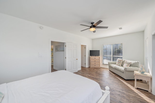 bedroom featuring ceiling fan and dark wood-type flooring