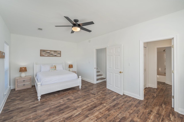 bedroom with ceiling fan and dark wood-type flooring