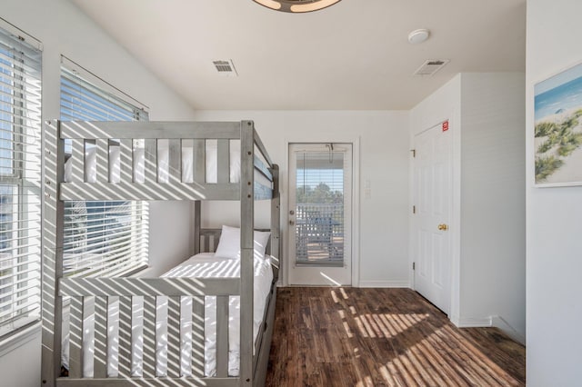 unfurnished bedroom with dark hardwood / wood-style flooring