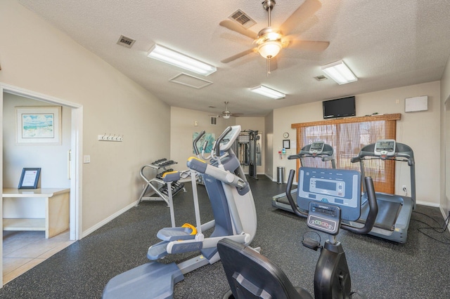 exercise room featuring ceiling fan and a textured ceiling