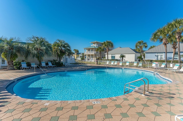 view of pool featuring a patio