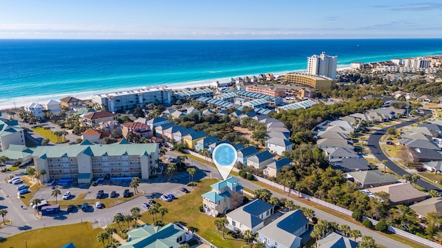 aerial view featuring a view of the beach and a water view