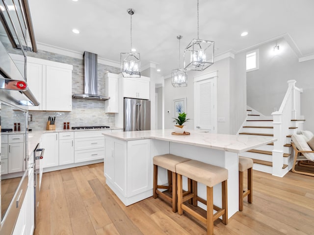 115 Woody Wagon Way, Inlet Beach, FL 32461 - kitchen with stainless steel fridge, wall chimney range hood, ornamental molding, a kitchen island, and a chandelier
