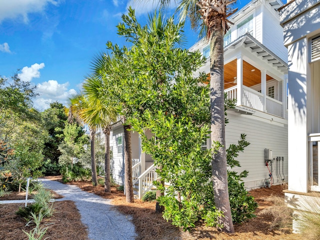 view of side of property featuring a balcony