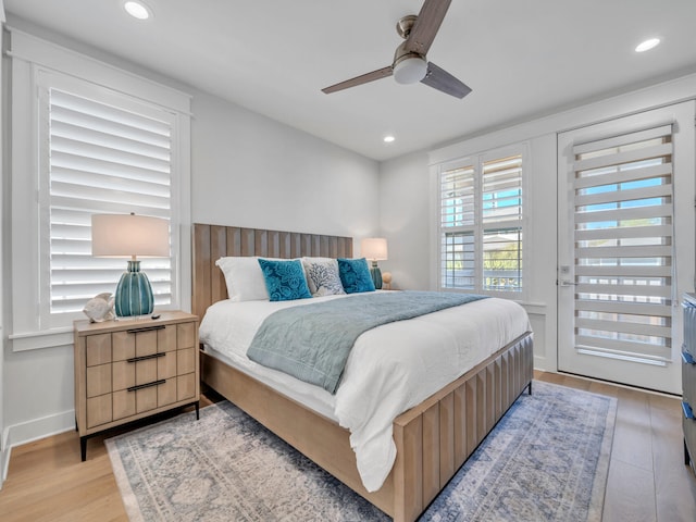 bedroom featuring ceiling fan and light hardwood / wood-style flooring