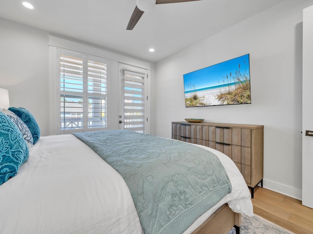 bedroom with hardwood / wood-style floors and ceiling fan