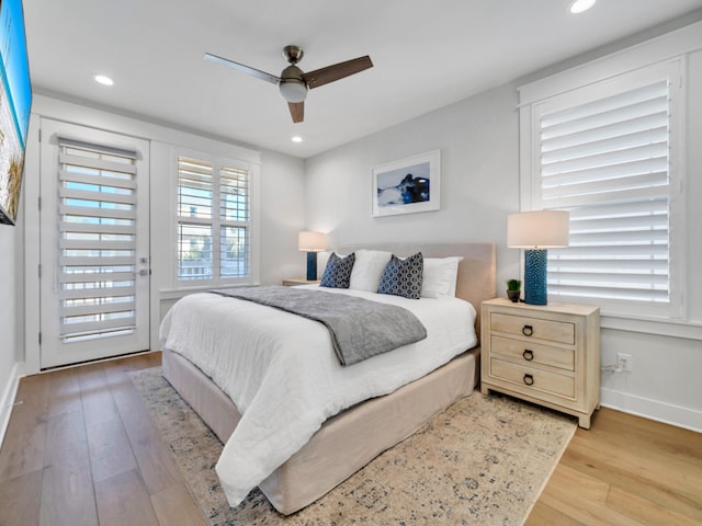 bedroom featuring light hardwood / wood-style floors and ceiling fan