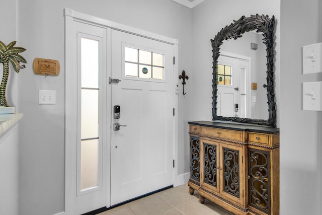 foyer featuring light tile patterned flooring