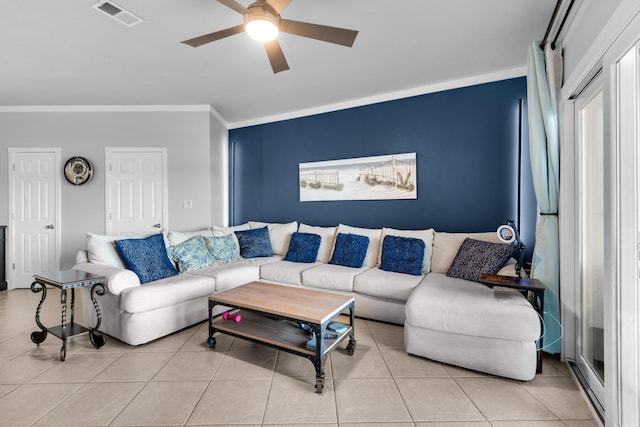 living room with ceiling fan, light tile patterned flooring, and ornamental molding